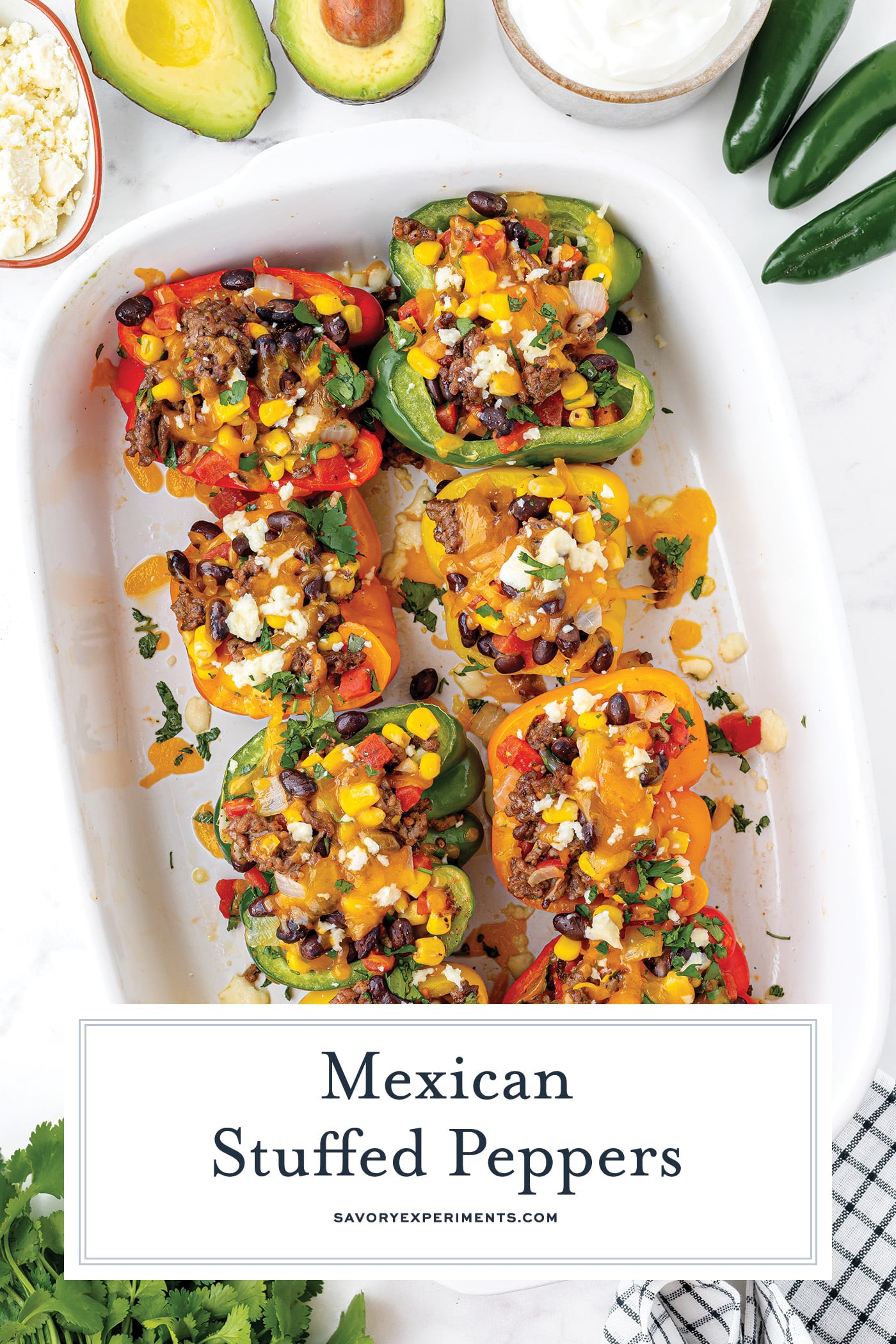 overhead shot of pan of mexican stuffed peppers with text overlay for pinterest