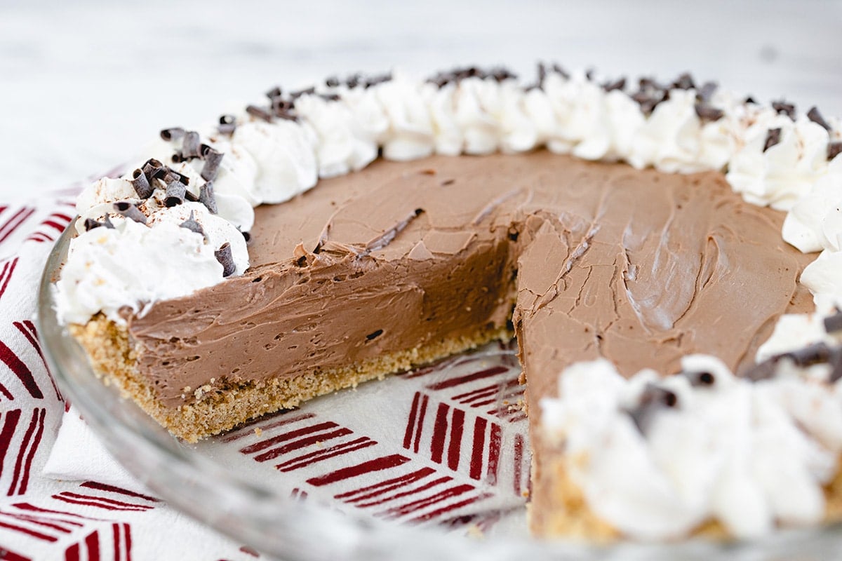 angled shot of slice cut out of no bake chocolate cheesecake