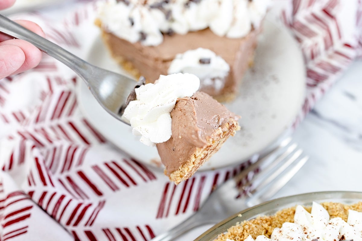 bite of no bake chocolate cheesecake on fork