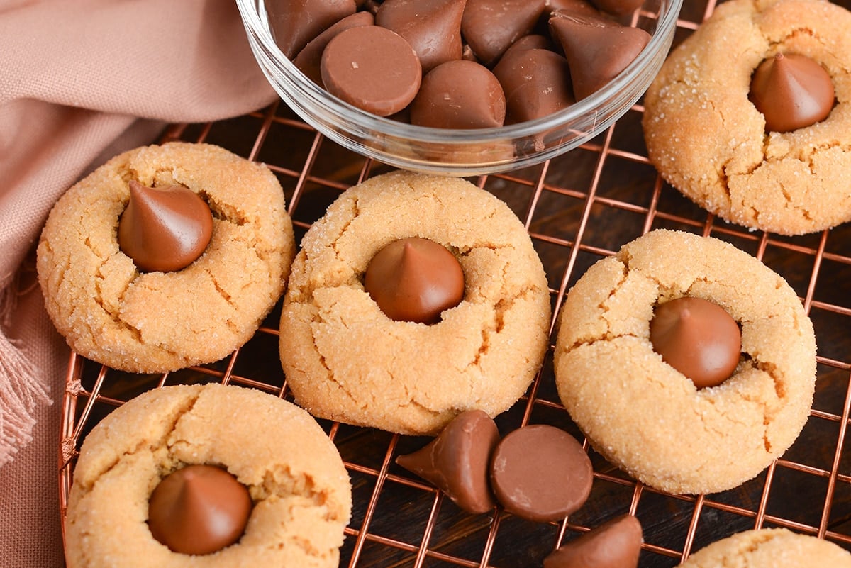 close up of four peanut butter blossom cookies