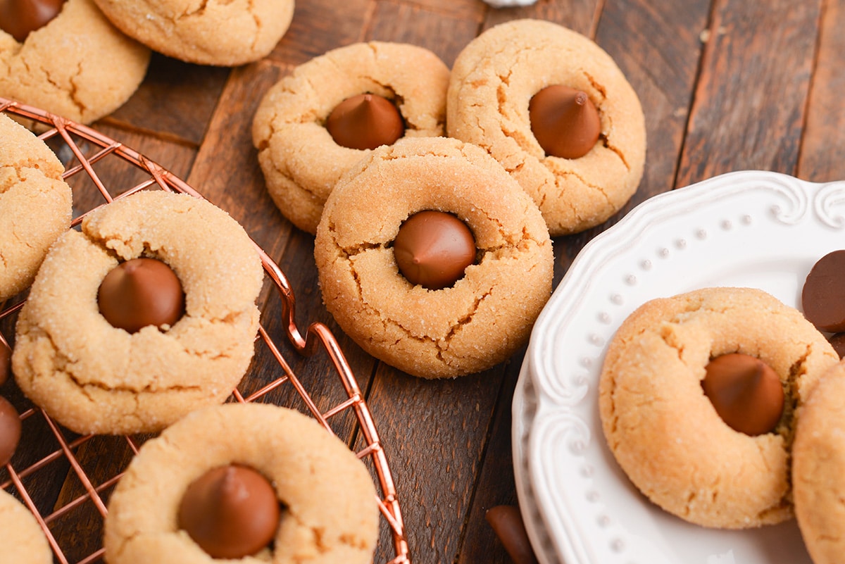 angled shot of pile of peanut butter blossom cookies