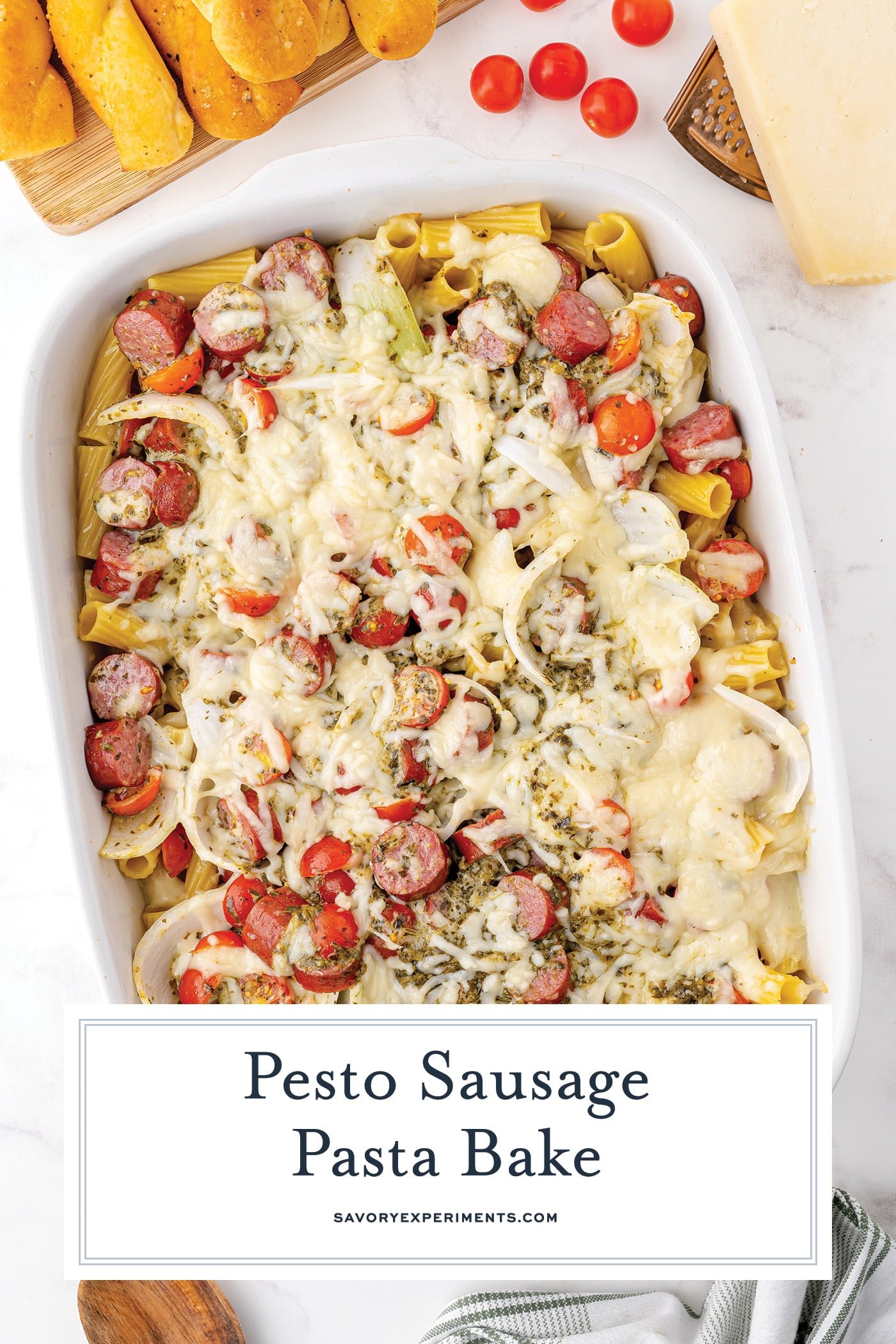 overhead shot of sausage pasta bake in dish with text overlay for pinterest