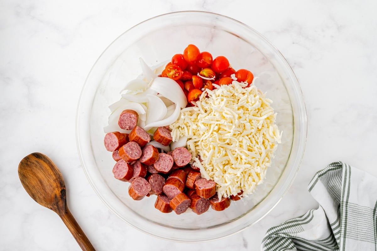 sausage pasta bake ingredients in a bowl