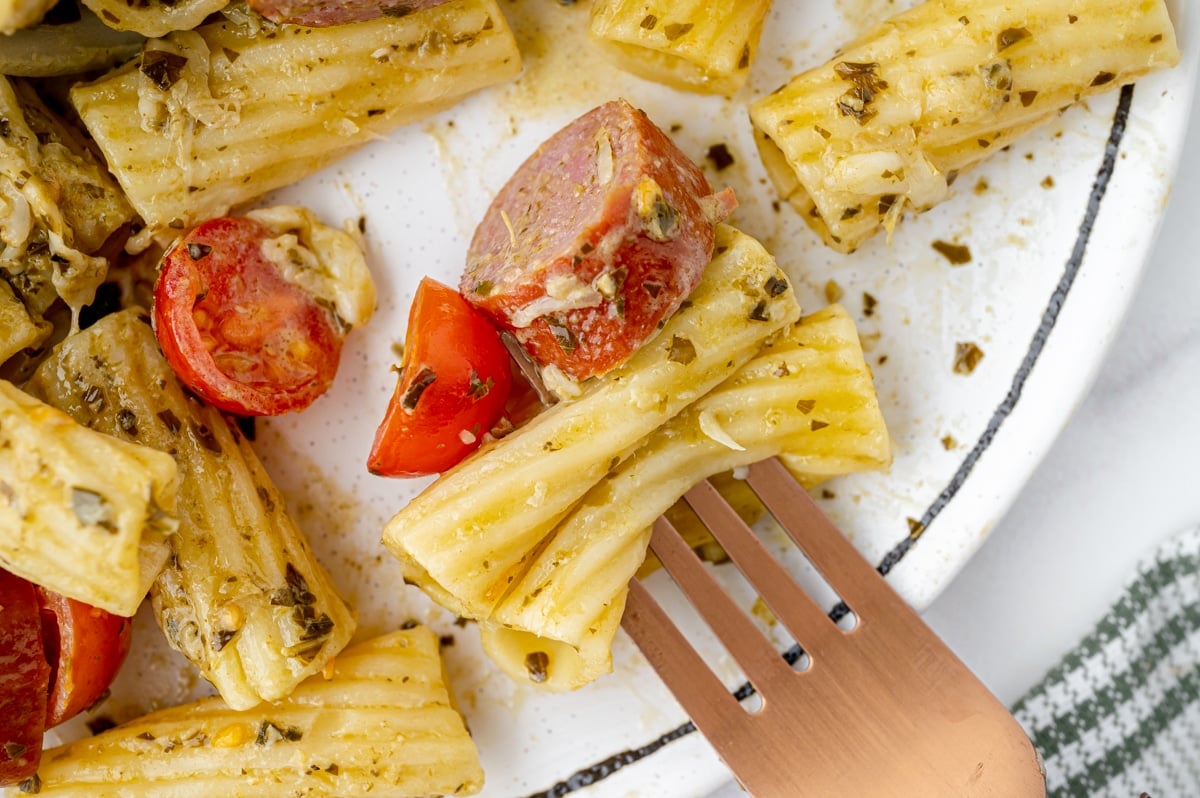 bite of sausage pasta bake on fork