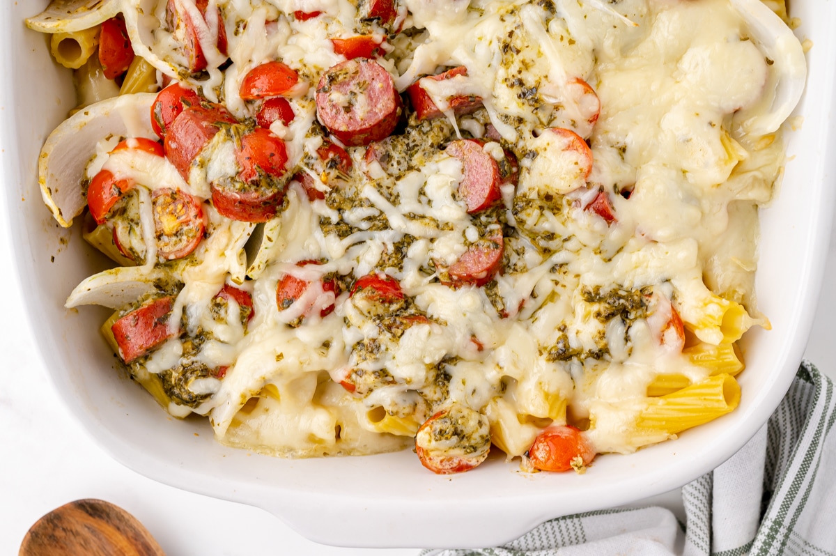 overhead shot of baked sausage pesto pasta