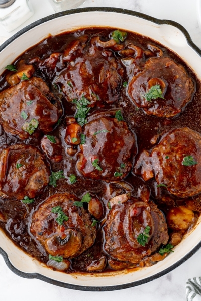 overhead shot of salisbury steaks in a skillet