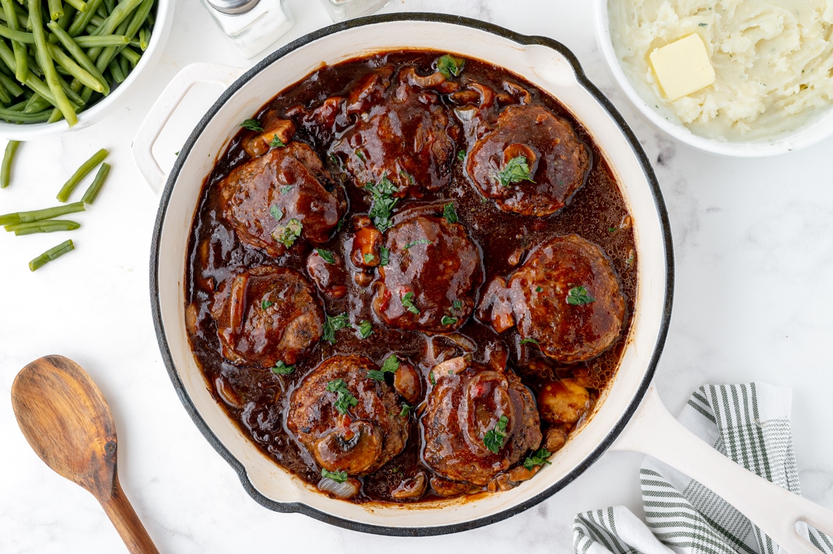 overhead shot of salisbury steaks in a skillet