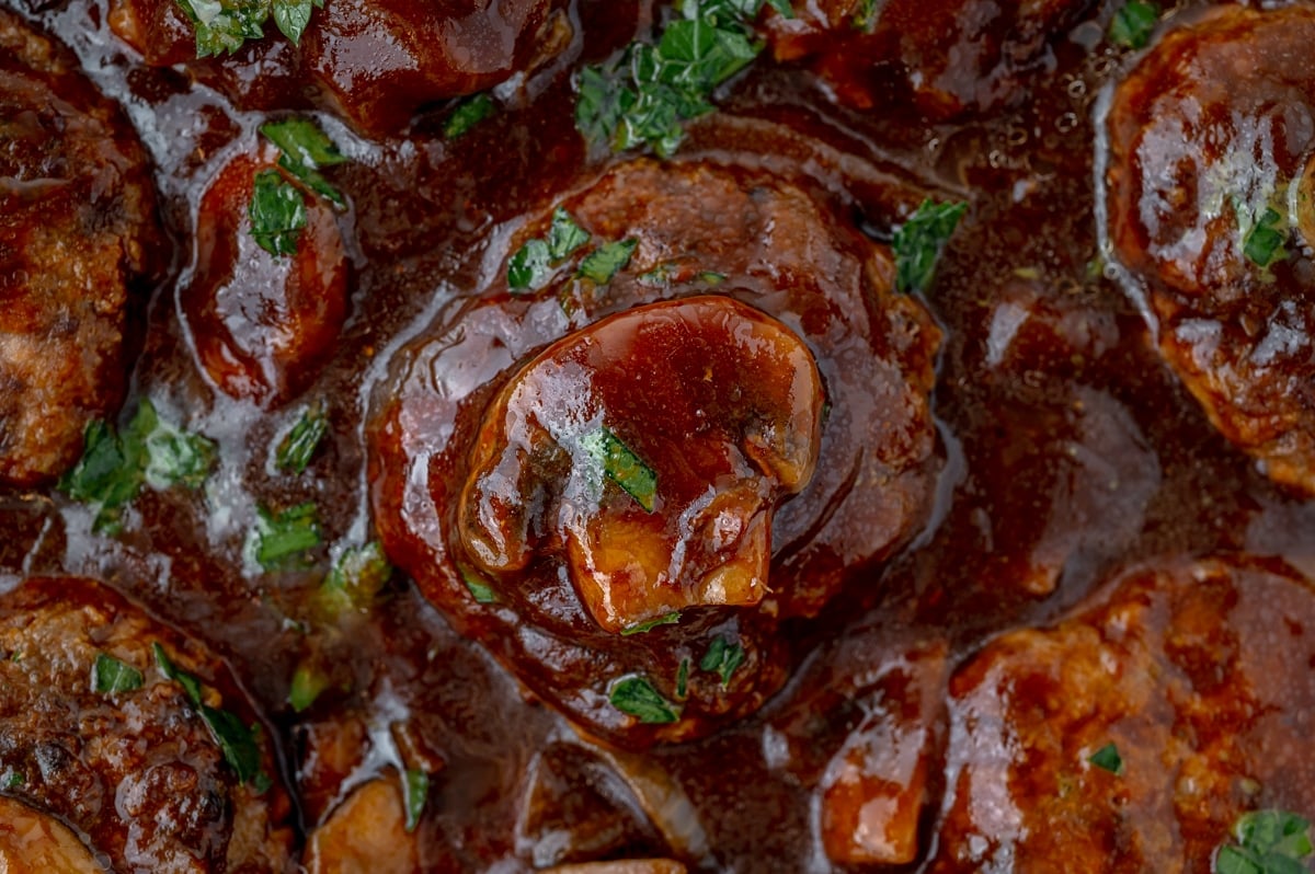 close up of skillet of salisbury steaks