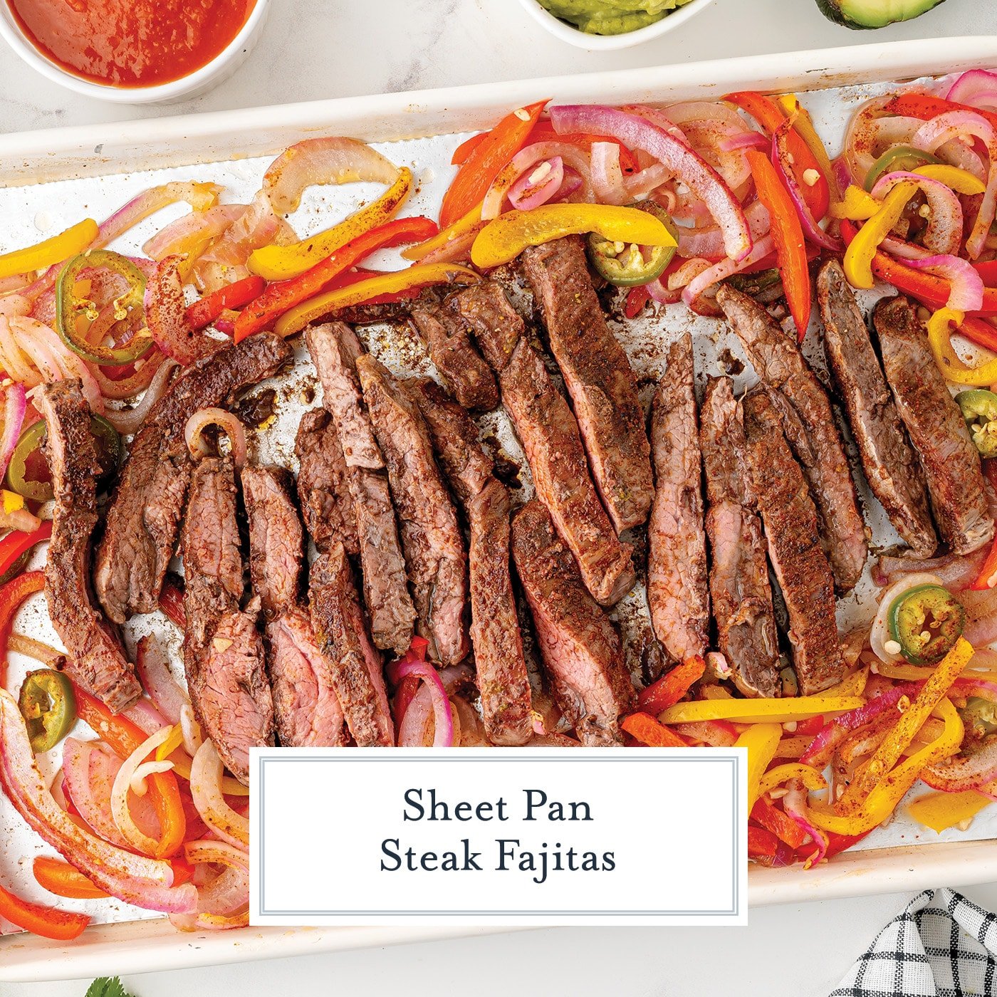 sliced steak on sheet pan with veggies with text overlay for facebook