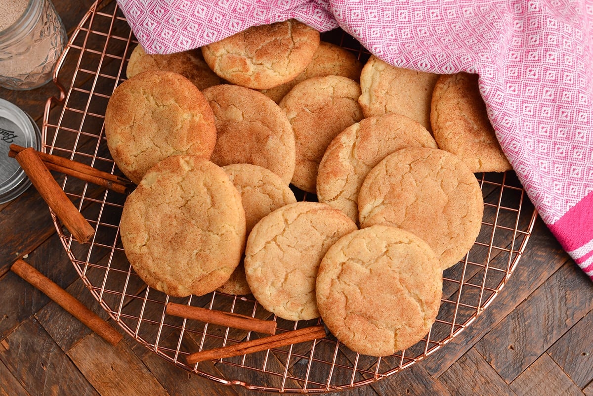 overhead shot of pile of snickerdoodle cookies on cooling rack