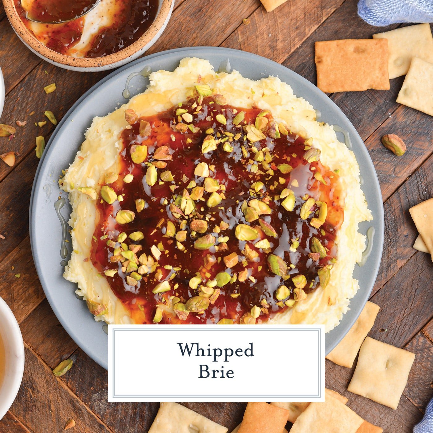 overhead shot of whipped brie on a plate with text overlay for facebook
