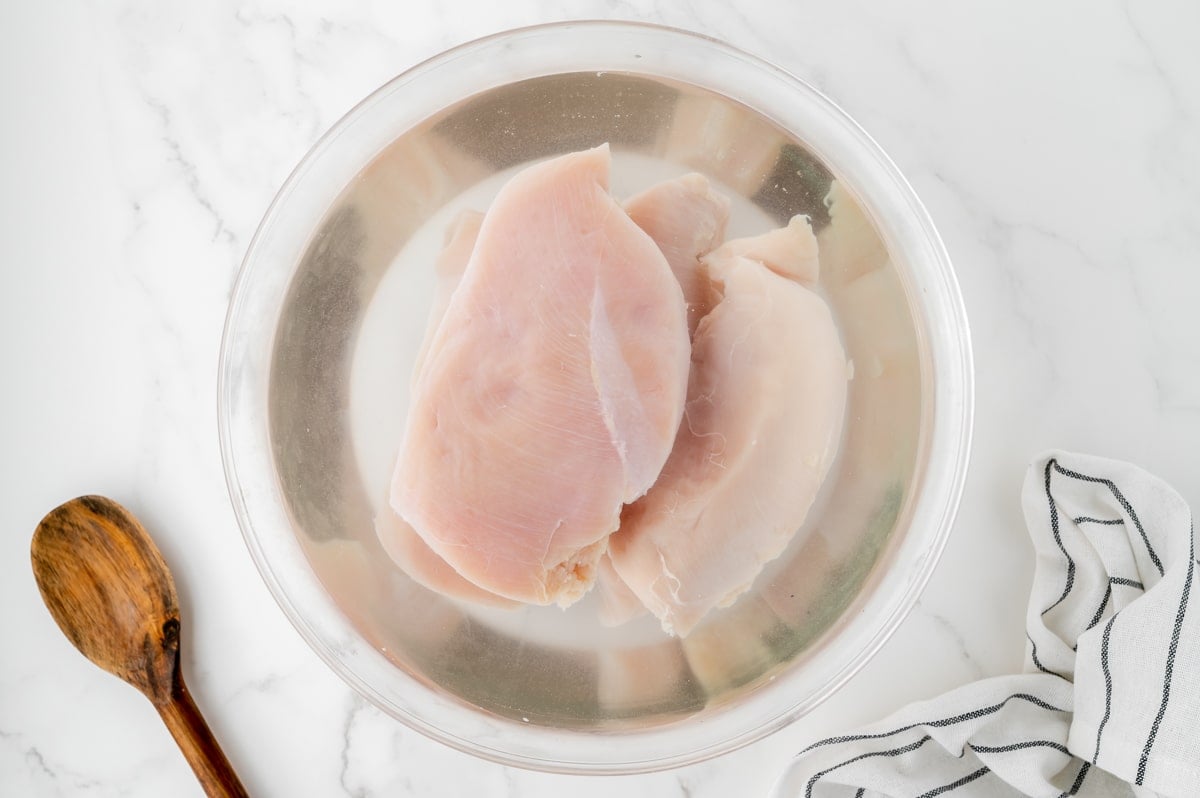 chicken brining in a bowl