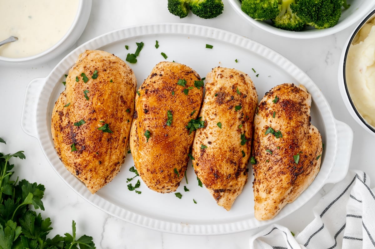 baked chicken breasts on a platter