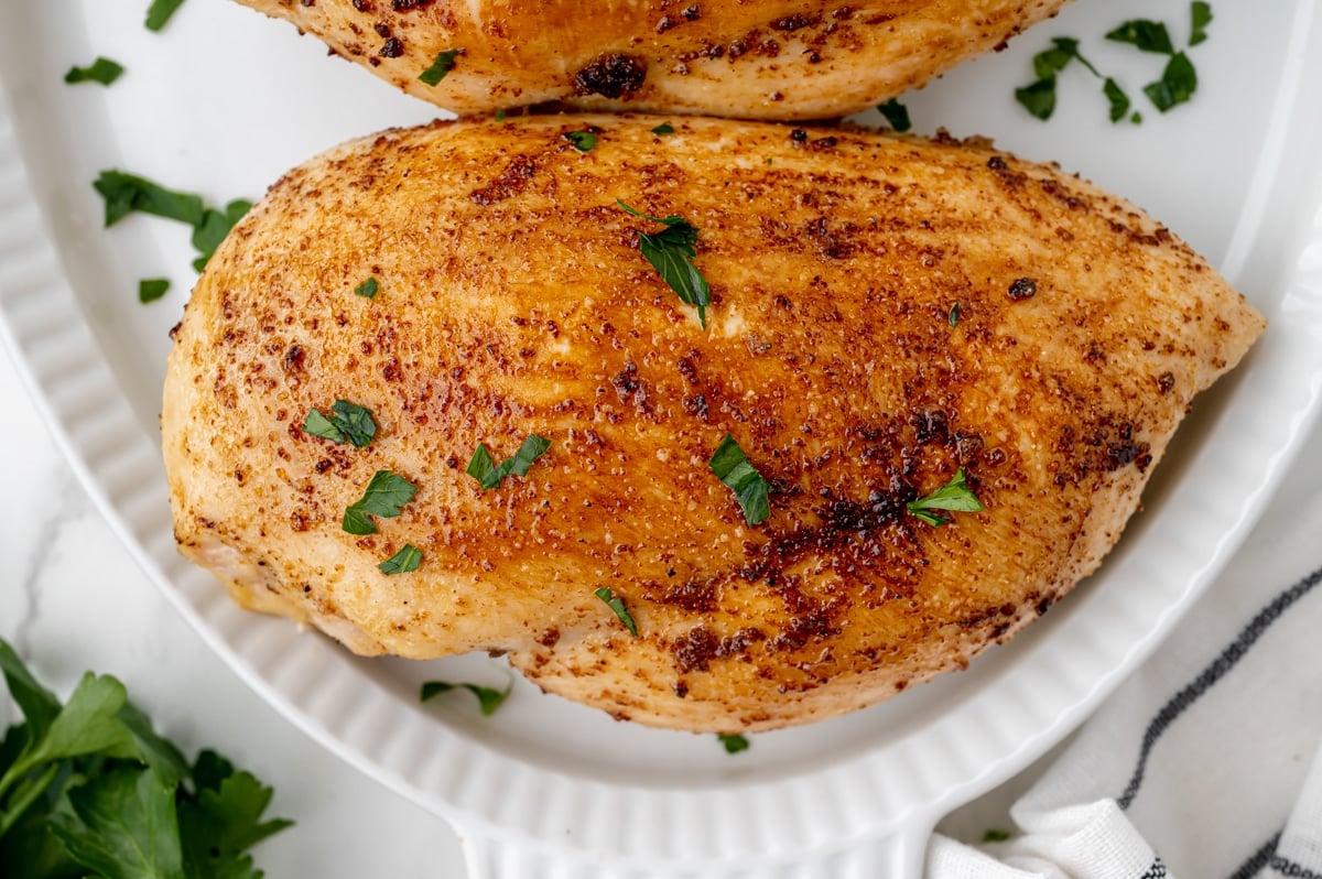 close up overhead shot of juicy baked chicken breast