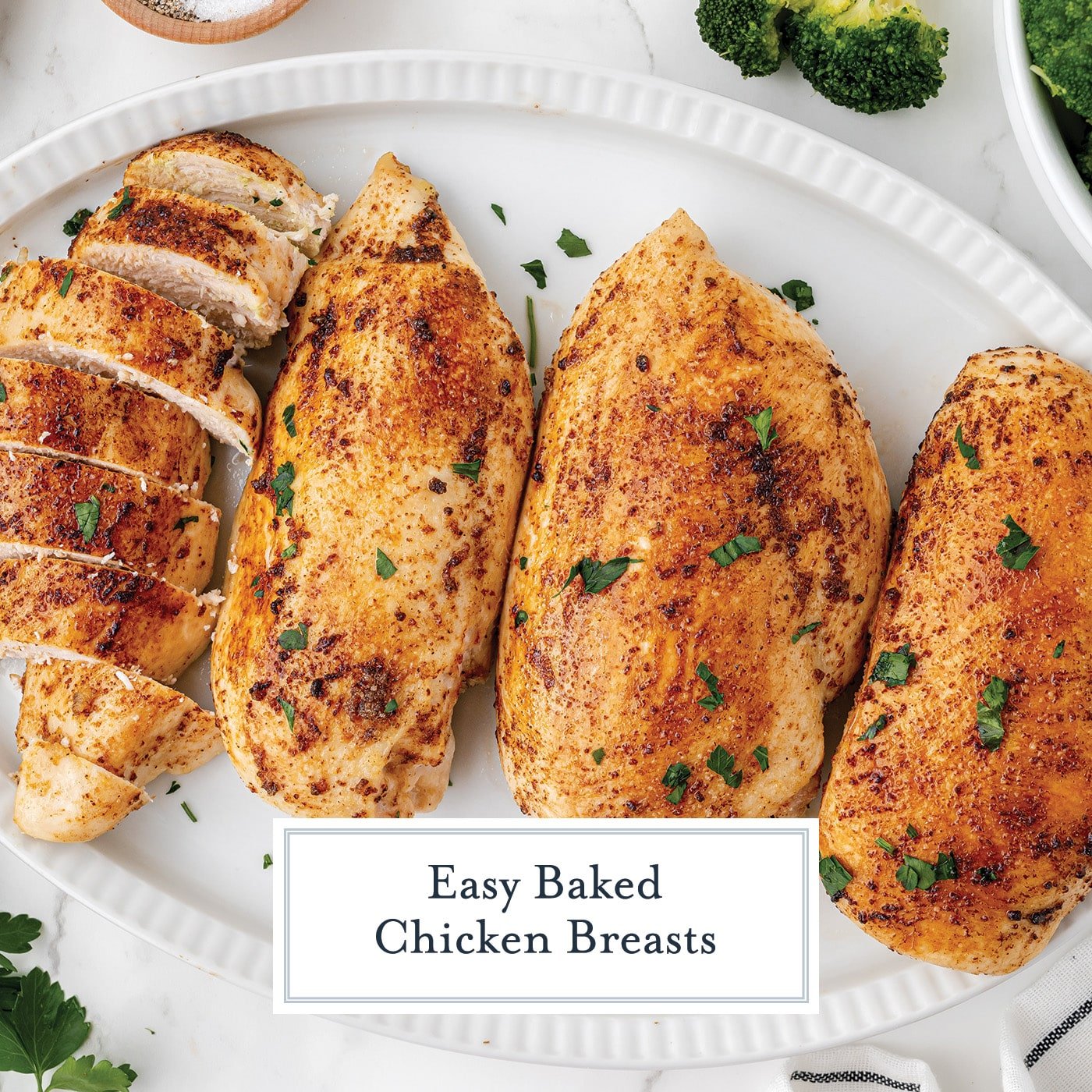 overhead shot baked chicken breasts on platter with text overlay for facebook