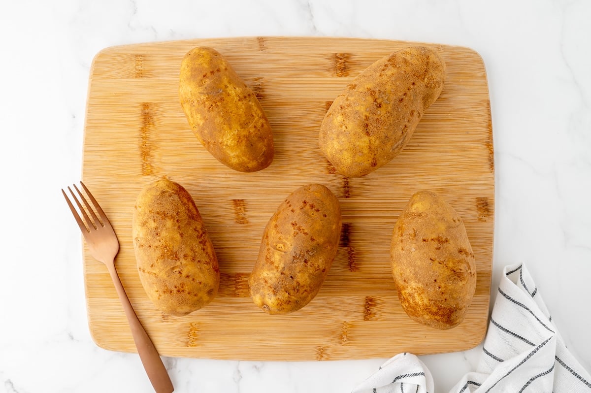 potatoes on cutting board with fork