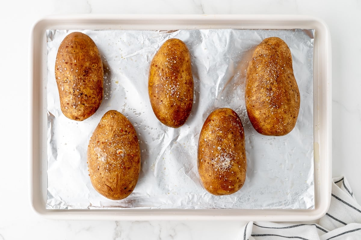 baked potatoes in oven on sheet pan