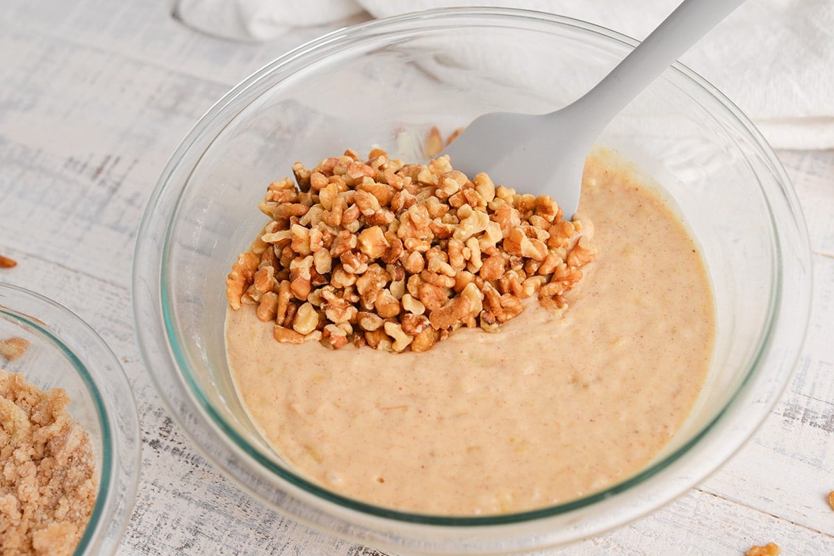 walnuts folding into banana bread batter