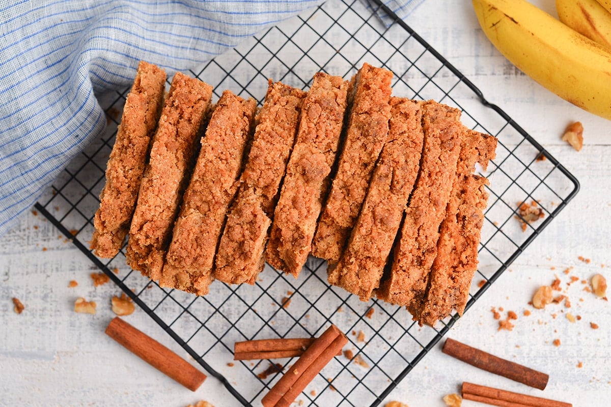 sliced banana nut bread with streusel topping on a wire rack