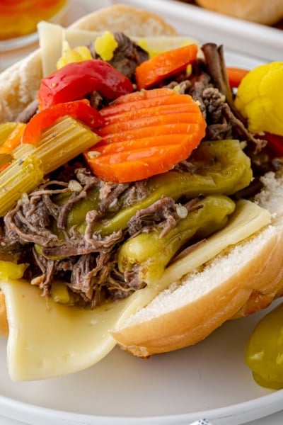 angled shot of italian beef sandwich on plate