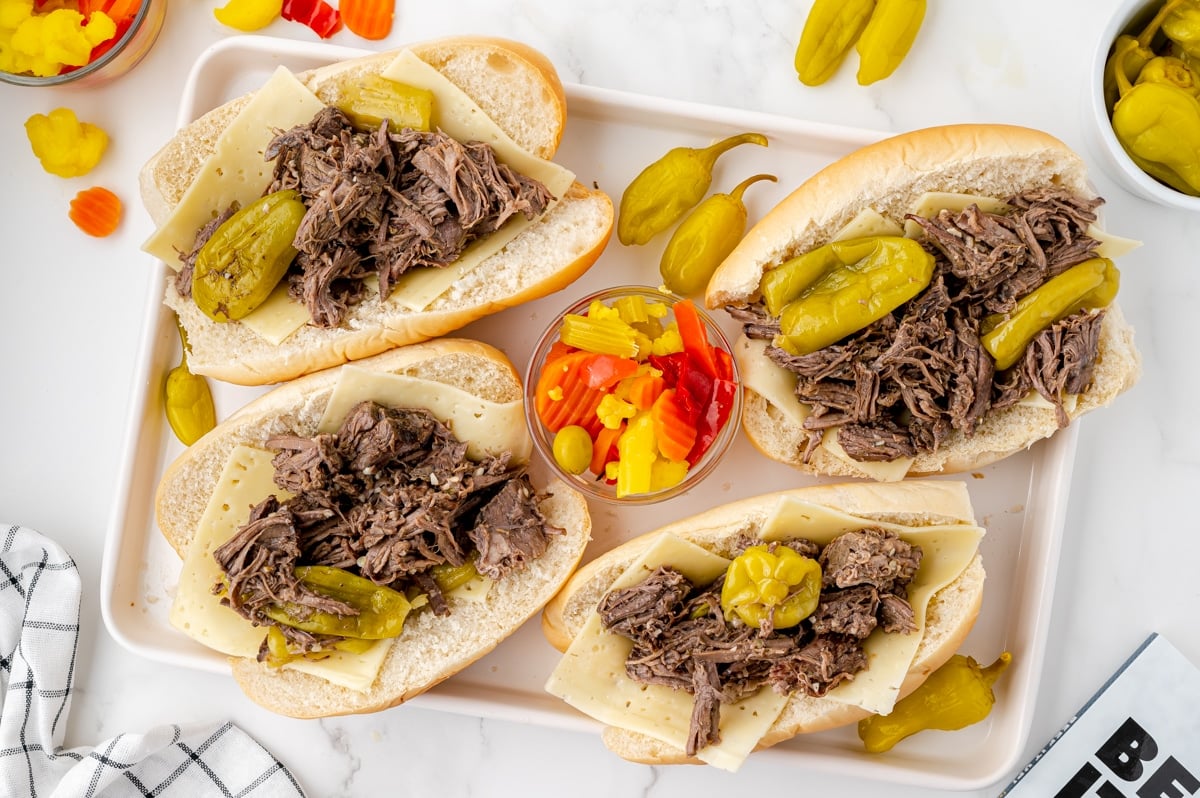 overhead shot of four buns topped with shredded beef