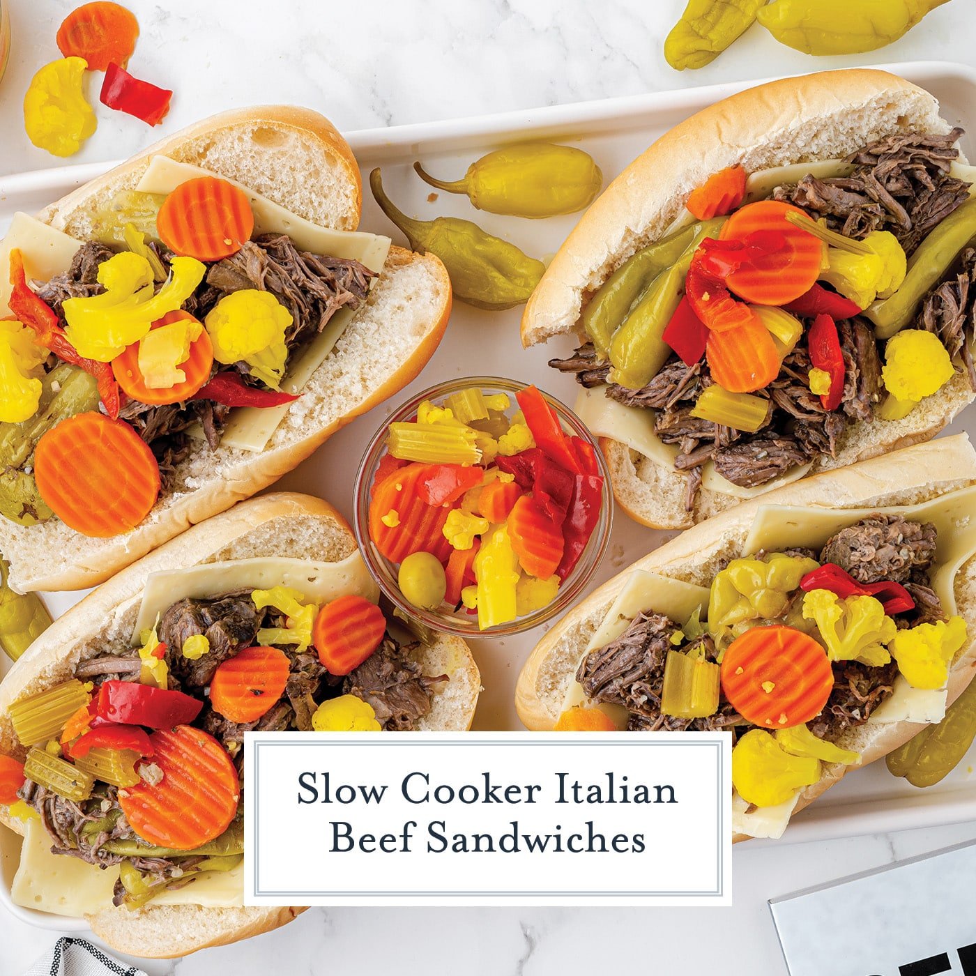overhead shot of tray of italian beef sandwiches with text overlay for facebook