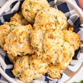 overhead shot of basket of cheese herb biscuits