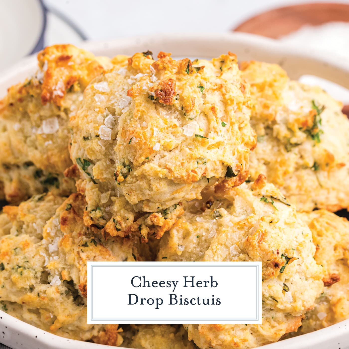 angled shot of bowl cheese herb biscuits