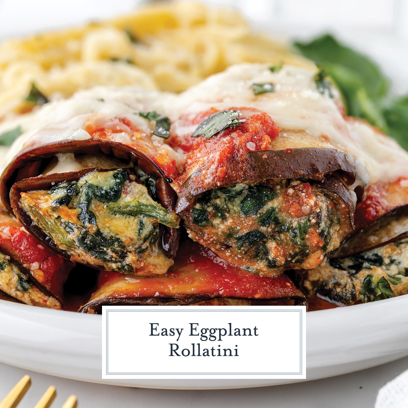 straight on shot of eggplant rollatini on a plate with text overlay for facebook