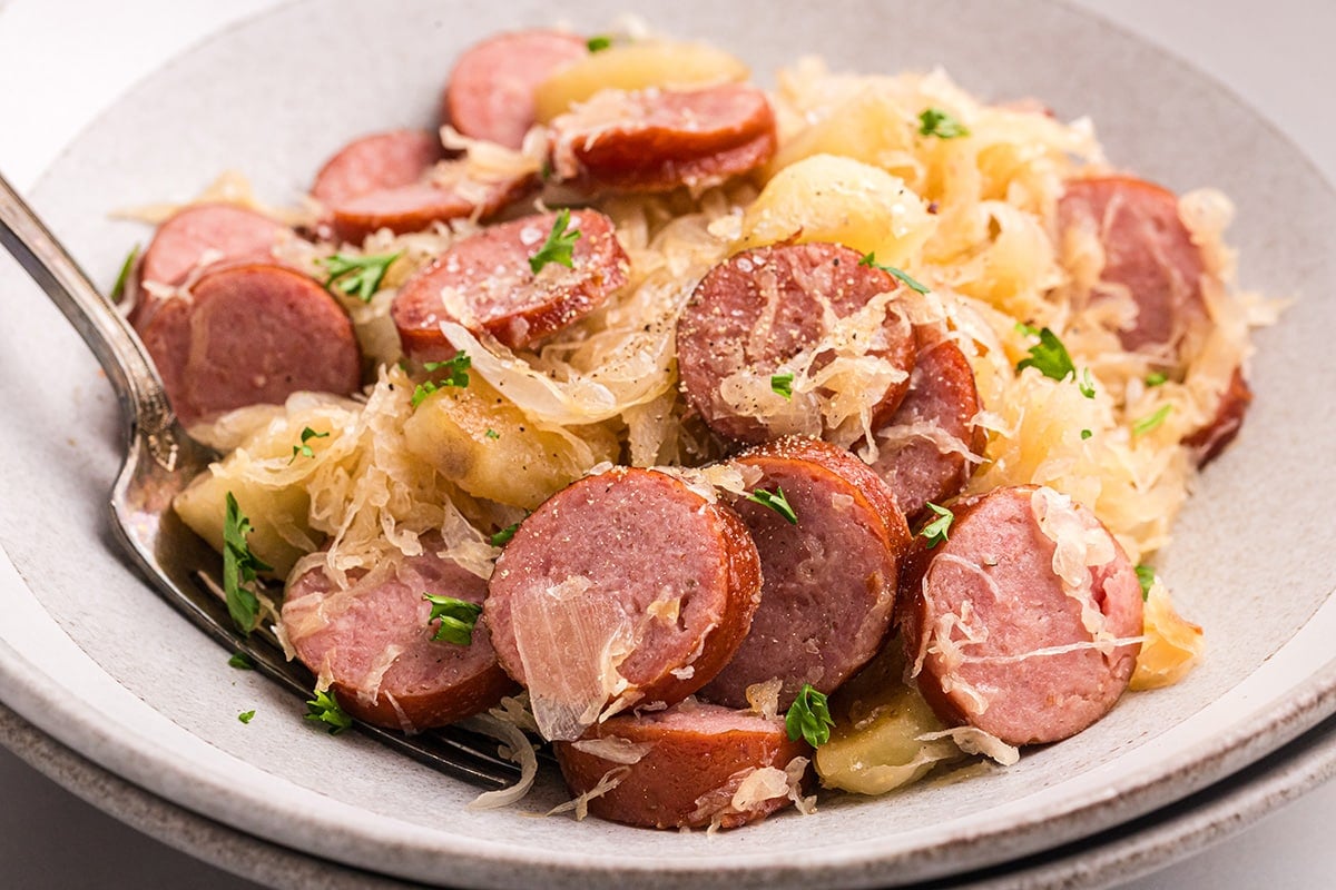 angled shot of plate of pork and sauerkraut