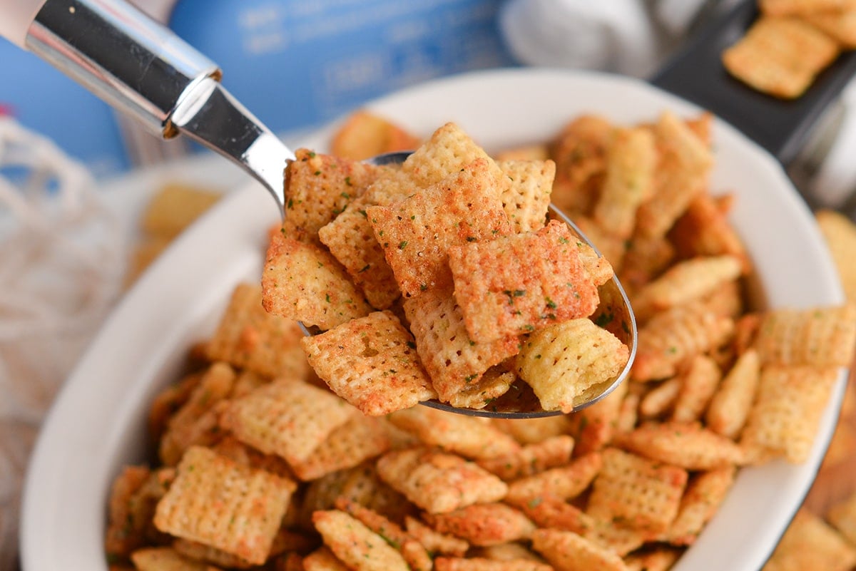 close up of spoon full of ranch chex mix