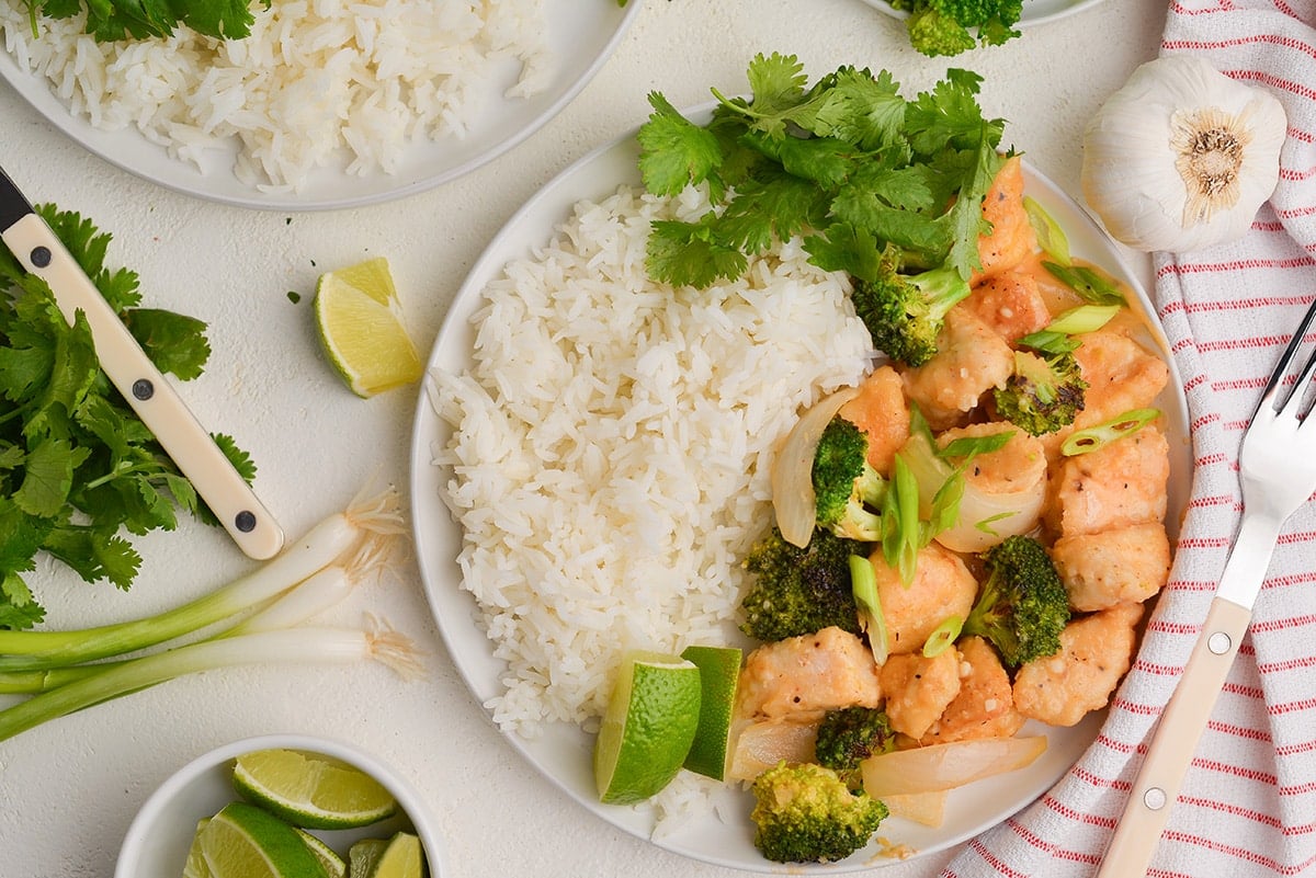 coconut rice with coconut milk chicken dish, scallions, limes and cilantro