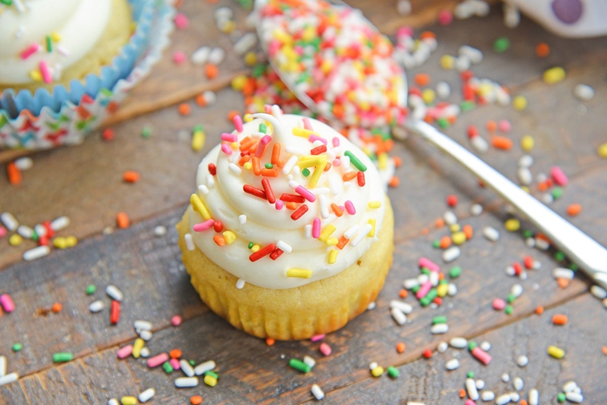 homemade vanilla cupcake without a liner wood table