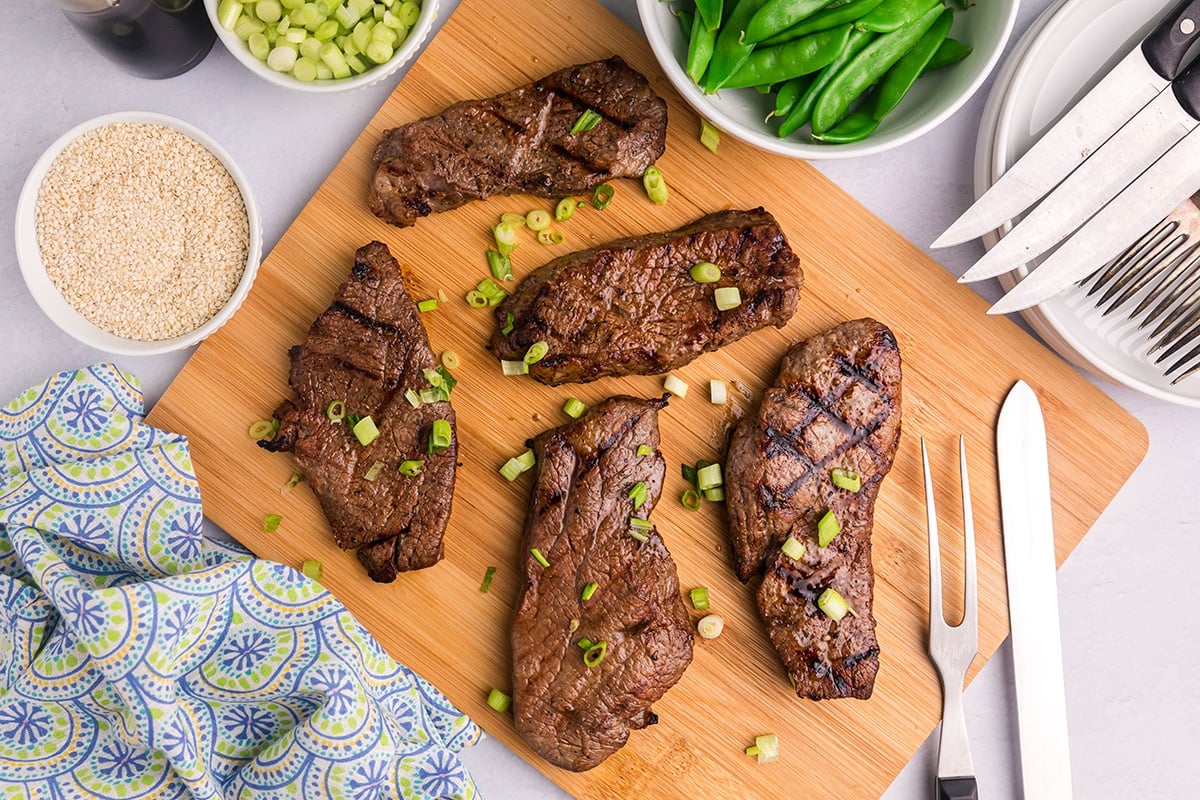 overhead shot of asian steak marinaded on cutting board