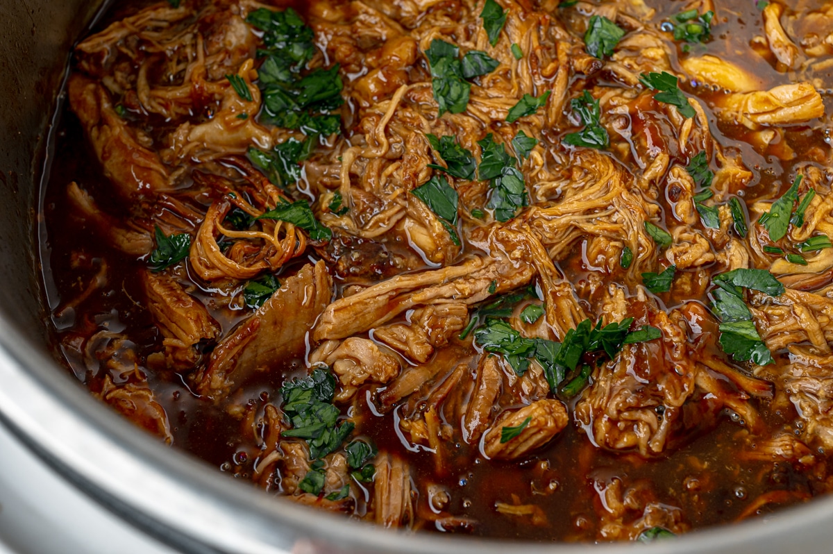 close up of pulled pork in instant pot