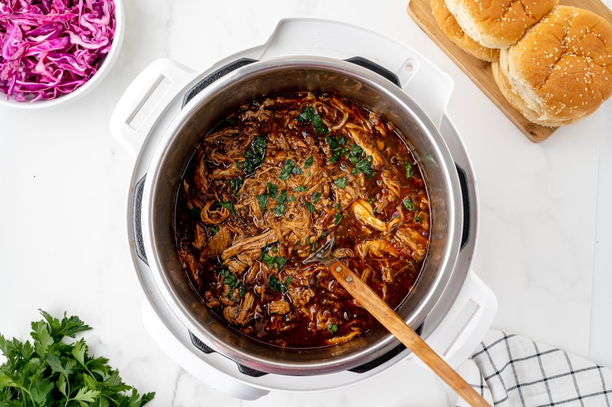 overhead shot of spoon in instant pot pulled pork