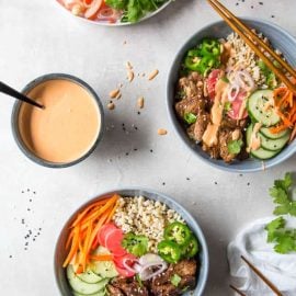 overhead shot of three banh mi rice bowls