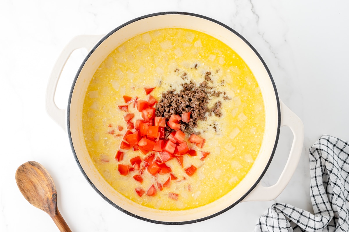 tomatoes and ground beef added to creamy soup base