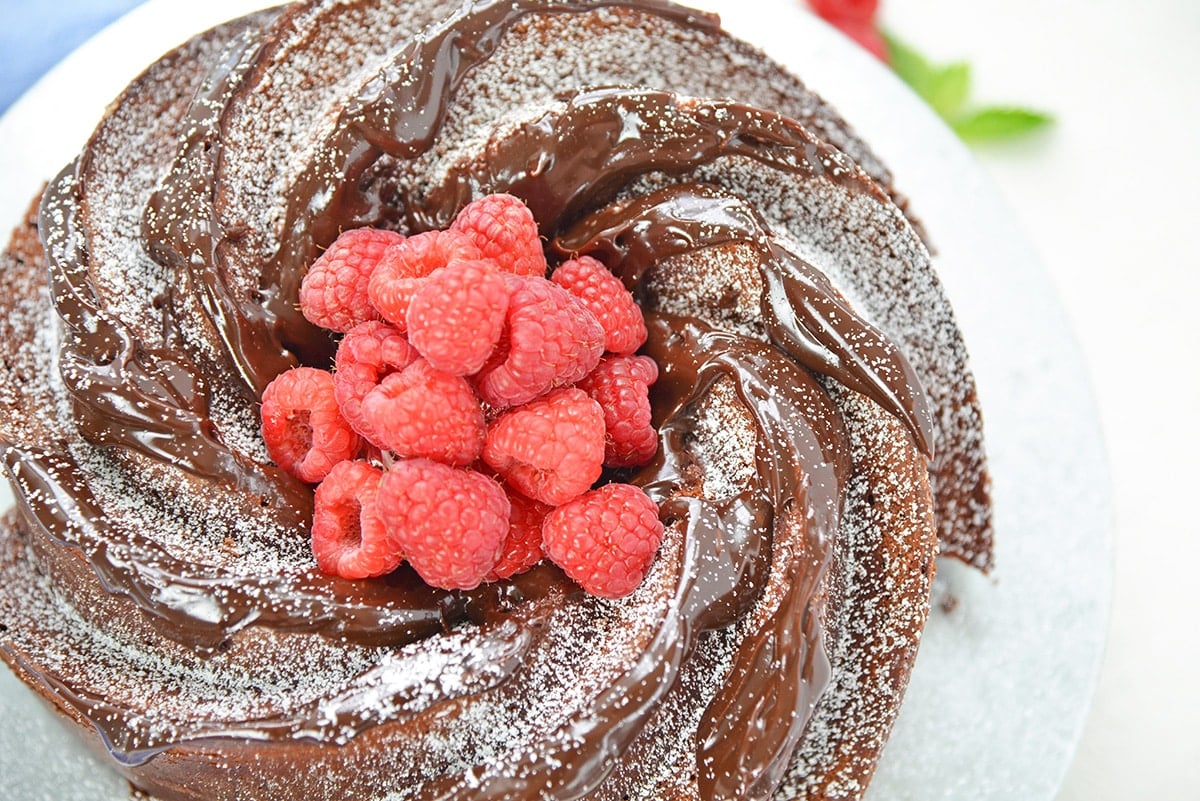 close up of swirls on a chocolate cake with chocolate drizzle