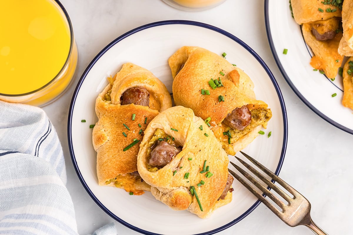 overhead of 3 breakfast sausage rollups on a plate