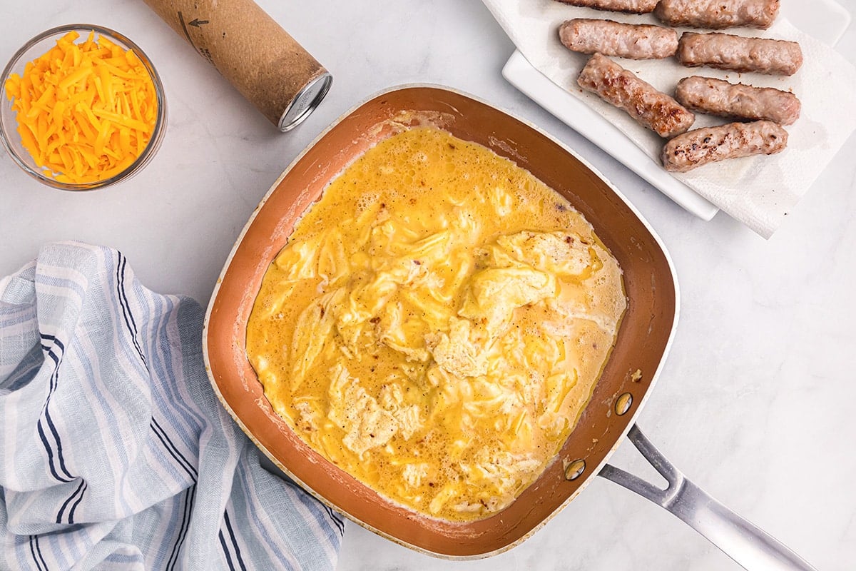 cooking scrambled eggs in a skillet