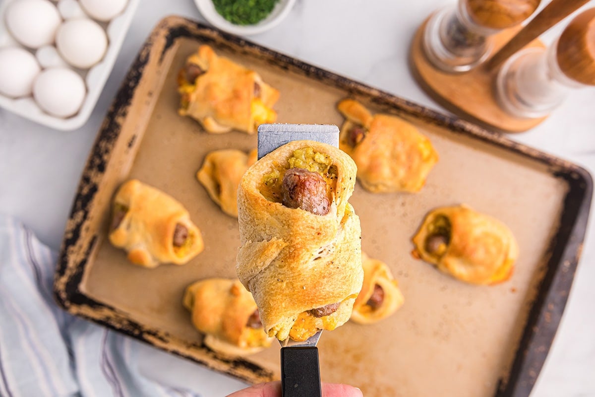 sausage rollup on a spatula