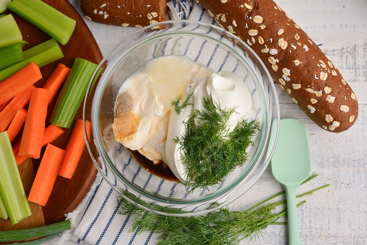 overhead shot of dill dip ingredients in bowl