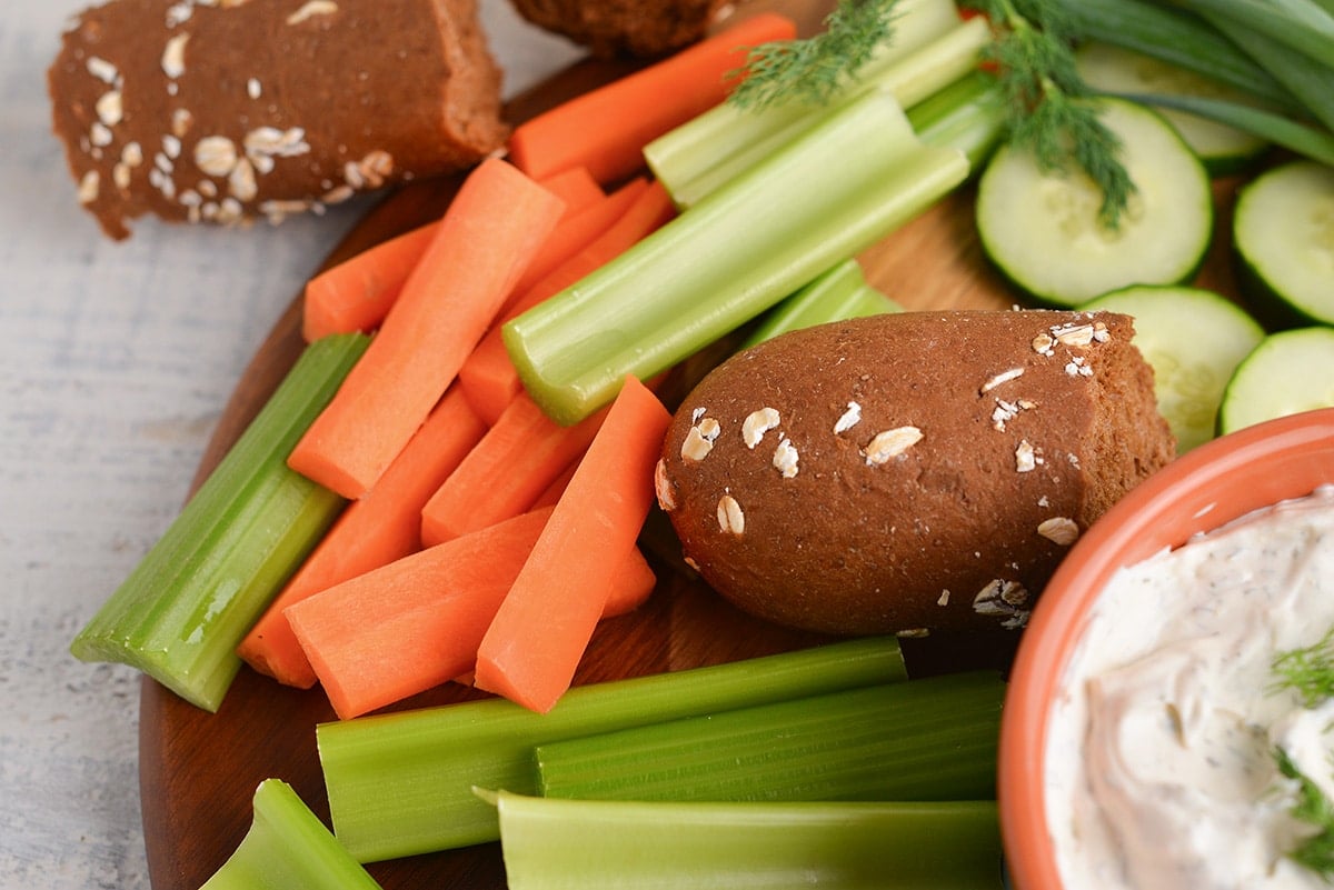 bread and veggies on a wooden board