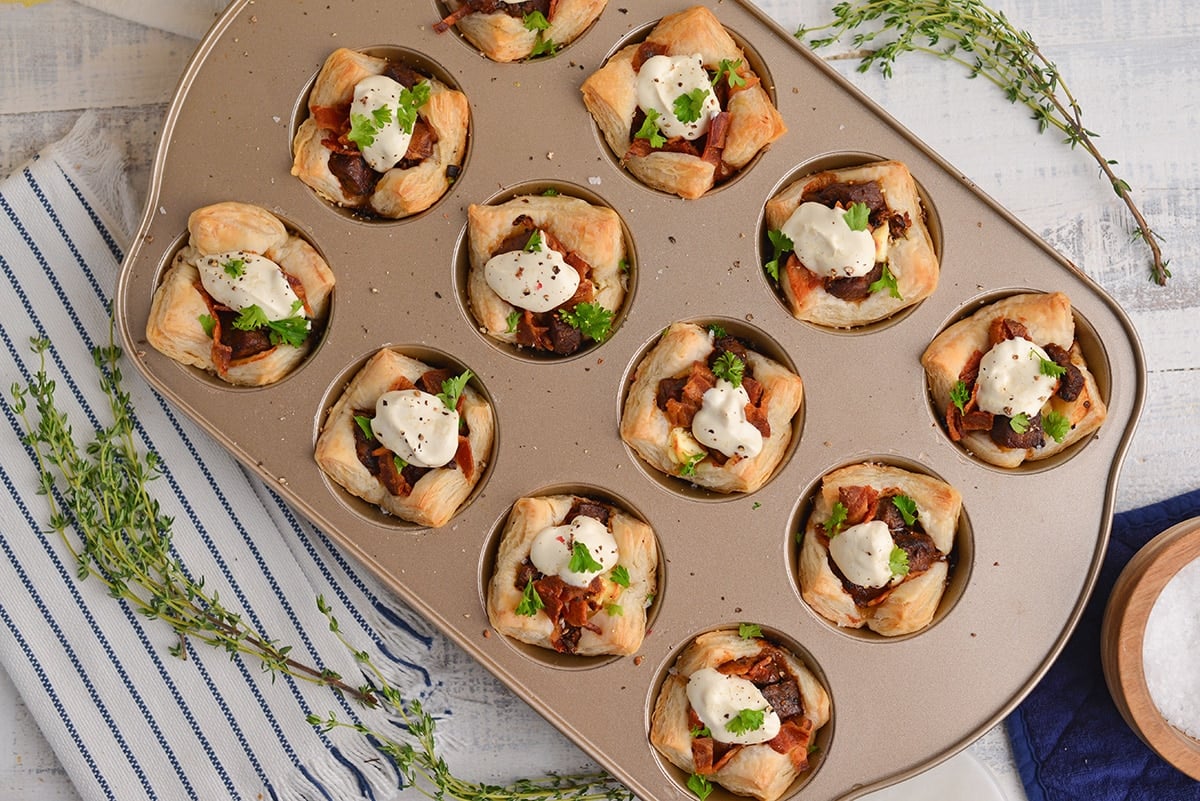 overhead of beef wellington in a muffin tin