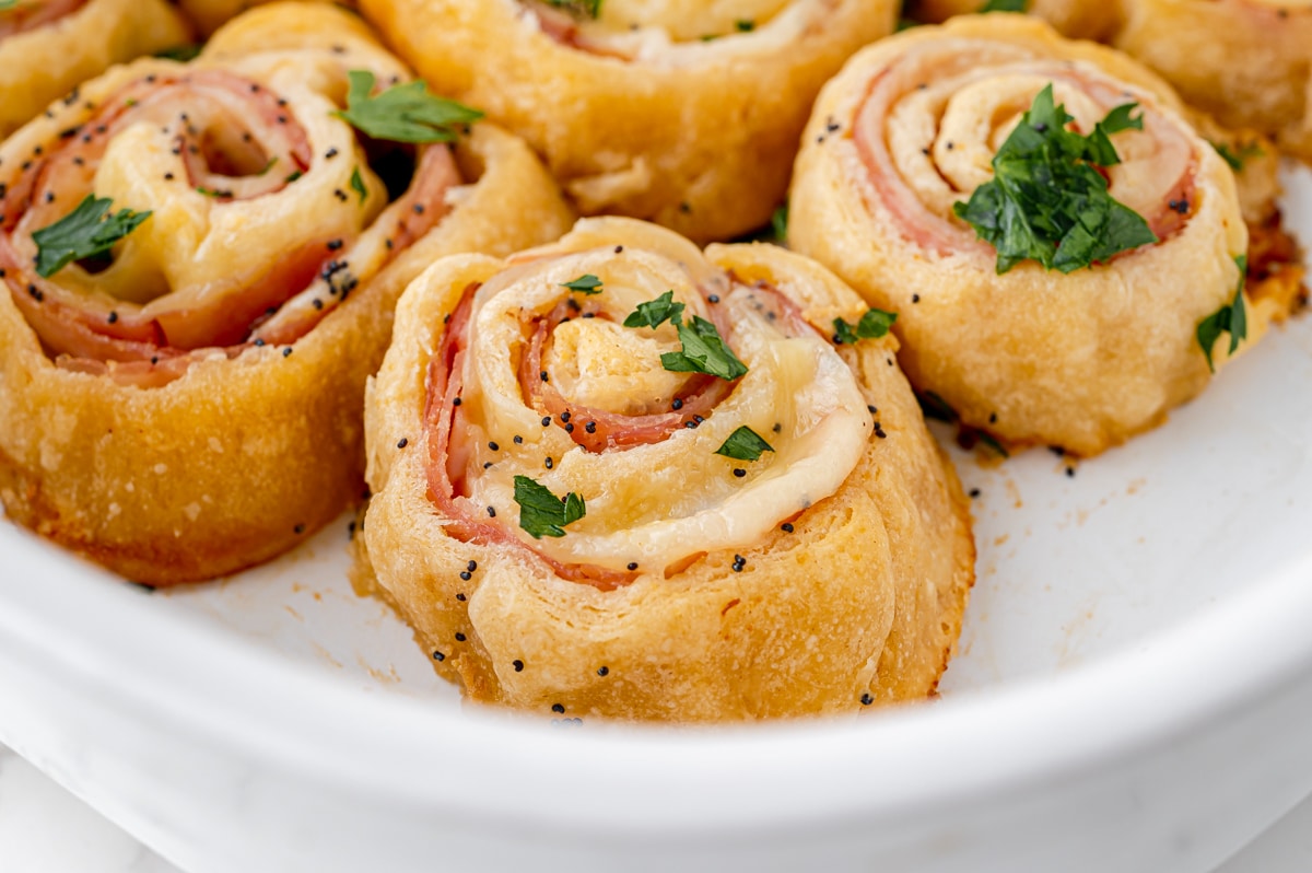 angled close up shot of pinwheels in baking dish