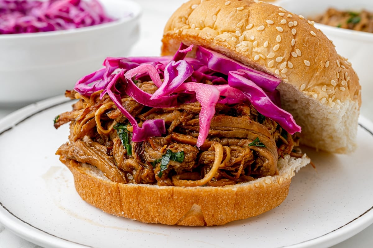 straight on shot of red cabbage on pulled pork sandwich