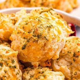 close up of basket of cheddar bay biscuits