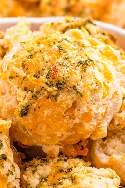 close up of basket of cheddar bay biscuits