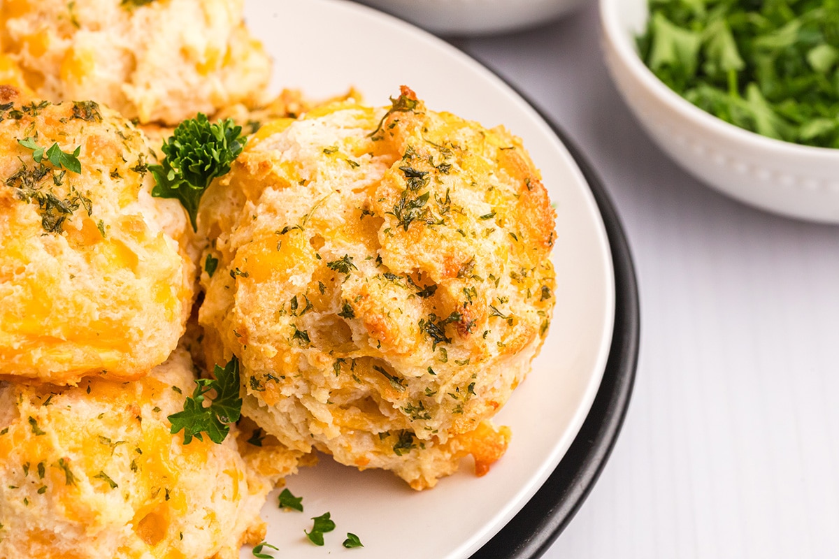 angled shot of red lobster biscuit on white plate